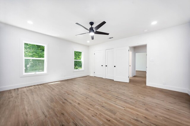 508 Jefferson Ave, Lufkin, TX 74904 - unfurnished bedroom featuring wood finished floors, baseboards, recessed lighting, and ceiling fan