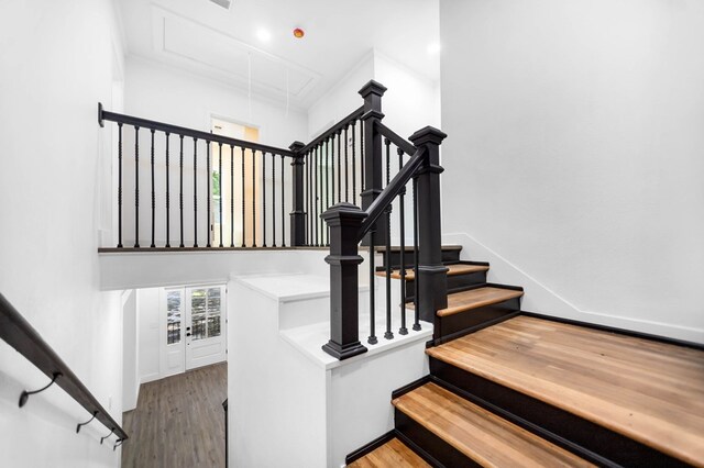 508 Jefferson Ave, Lufkin, TX 74904 - staircase featuring attic access, wood finished floors, and baseboards