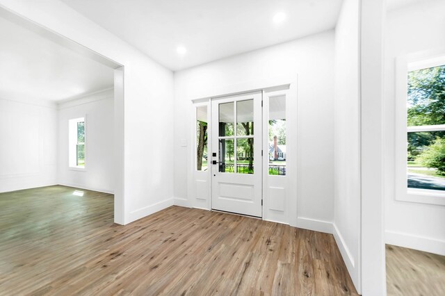 508 Jefferson Ave, Lufkin, TX 74904 - entrance foyer featuring plenty of natural light, light wood-style floors, baseboards, and recessed lighting