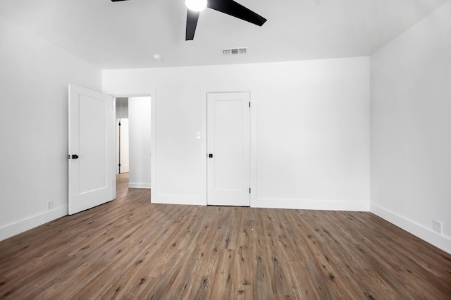 508 Jefferson Ave, Lufkin, TX 74904 - unfurnished bedroom with wood finished floors, baseboards, and ceiling fan