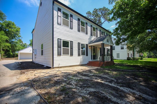 508 Jefferson Ave, Lufkin, TX 74904 - colonial house featuring a garage and an outdoor structure