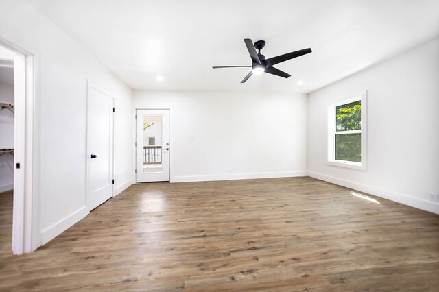 508 Jefferson Ave, Lufkin, TX 74904 - unfurnished bedroom featuring wood finished floors, recessed lighting, baseboards, and a ceiling fan