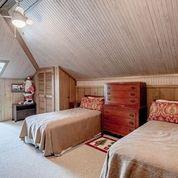208 E Livingston St, San Augustine, TX 75972 - carpeted bedroom featuring lofted ceiling and wood ceiling