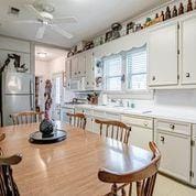 208 E Livingston St, San Augustine, TX 75972 - dining space featuring a ceiling fan