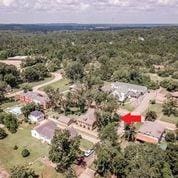 208 E Livingston St, San Augustine, TX 75972 - aerial overview of property's location with a forest