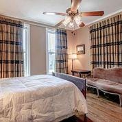 208 E Livingston St, San Augustine, TX 75972 - bedroom with wood finished floors