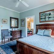 208 E Livingston St, San Augustine, TX 75972 - bedroom with crown molding, baseboards, and a ceiling fan