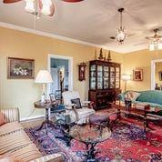 208 E Livingston St, San Augustine, TX 75972 - living area with a ceiling fan and crown molding
