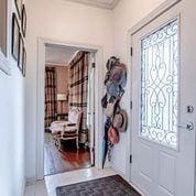 208 E Livingston St, San Augustine, TX 75972 - entrance foyer with plenty of natural light and ornamental molding