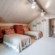 208 E Livingston St, San Augustine, TX 75972 - bedroom featuring vaulted ceiling