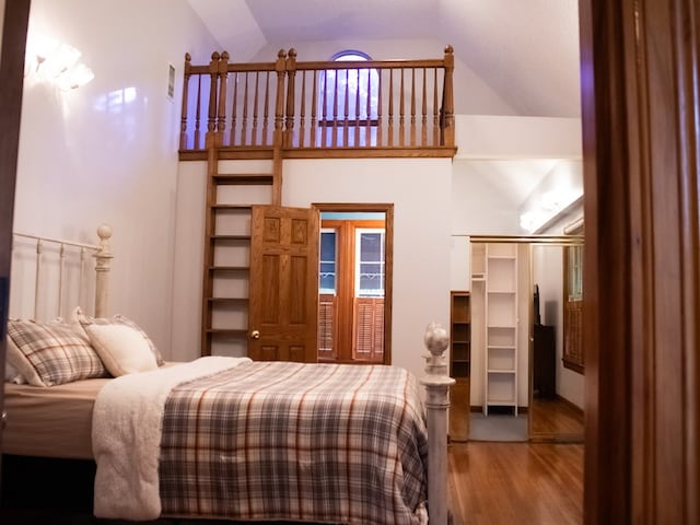 476 Jefferson Ave, Lufkin, TX 75904 - bedroom with wood finished floors, high vaulted ceiling, and a closet
