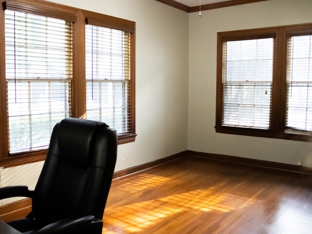 476 Jefferson Ave, Lufkin, TX 75904 - home office featuring light wood-type flooring, healthy amount of natural light, baseboards, and ornamental molding