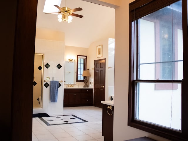 476 Jefferson Ave, Lufkin, TX 75904 - bathroom with tile patterned floors, a shower stall, ceiling fan, vanity, and healthy amount of natural light