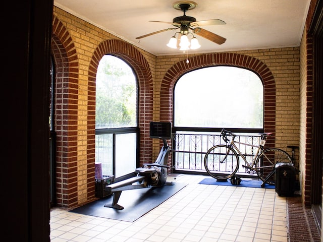 476 Jefferson Ave, Lufkin, TX 75904 - workout room with brick wall and ceiling fan