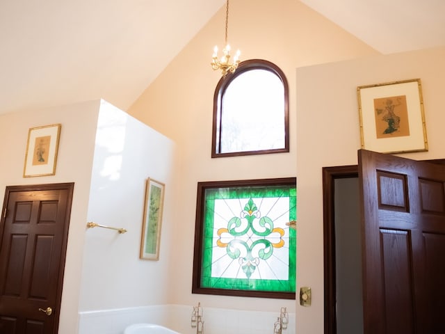 476 Jefferson Ave, Lufkin, TX 75904 - bathroom featuring a chandelier and vaulted ceiling