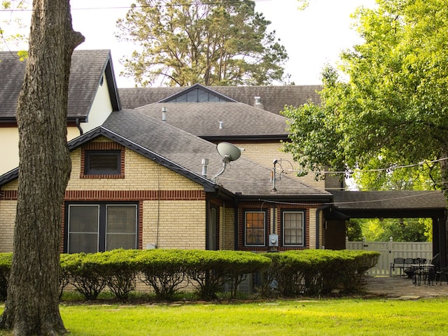 476 Jefferson Ave, Lufkin, TX 75904 - rear view of property featuring brick siding and a shingled roof