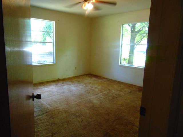 1202 Mimosa, Lufkin, TX 75901 - unfurnished room with healthy amount of natural light, carpet, and a ceiling fan