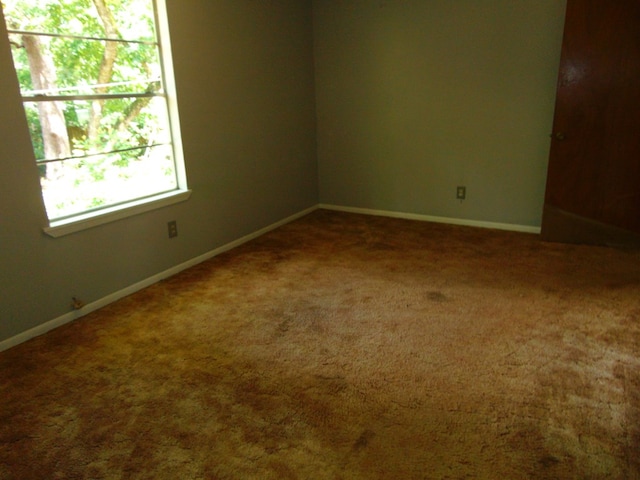 1202 Mimosa, Lufkin, TX 75901 - carpeted empty room with baseboards