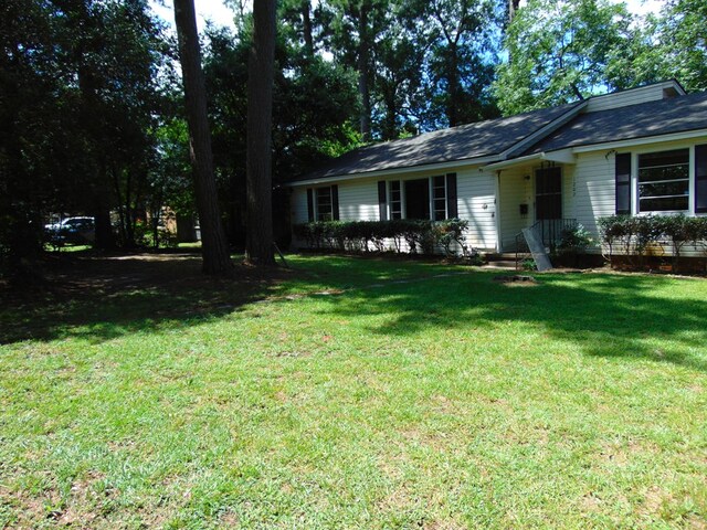 1202 Mimosa, Lufkin, TX 75901 - ranch-style home with a front yard