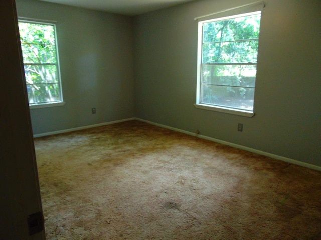 1202 Mimosa, Lufkin, TX 75901 - empty room with baseboards and carpet flooring