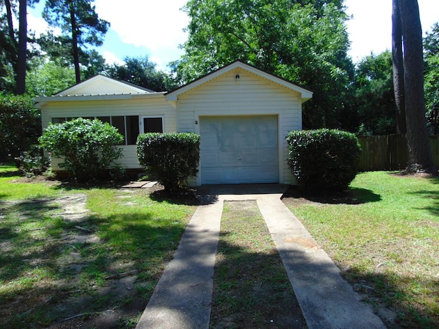 1202 Mimosa, Lufkin, TX 75901 - view of front facade featuring concrete driveway and an attached garage