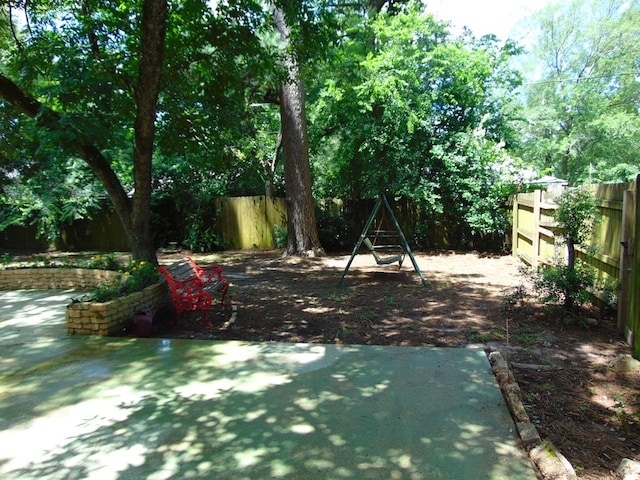 1202 Mimosa, Lufkin, TX 75901 - fenced backyard featuring a patio area