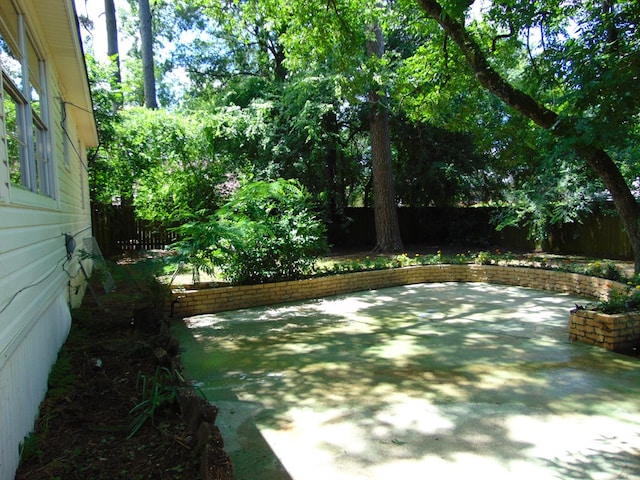 1202 Mimosa, Lufkin, TX 75901 - fenced backyard with a patio area