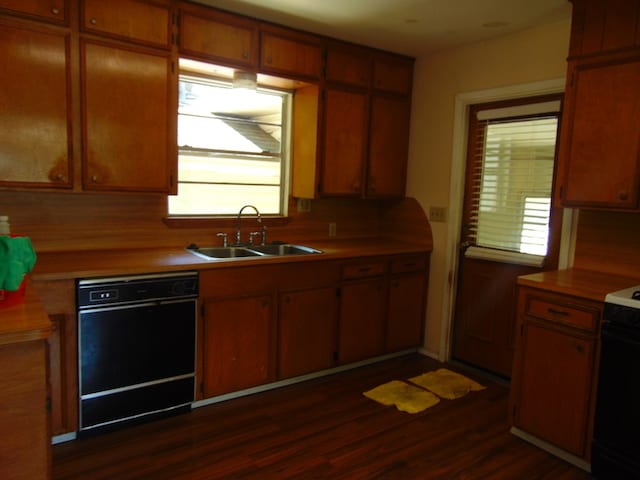 1202 Mimosa, Lufkin, TX 75901 - kitchen with dishwasher, electric stove, light countertops, dark wood-style floors, and plenty of natural light