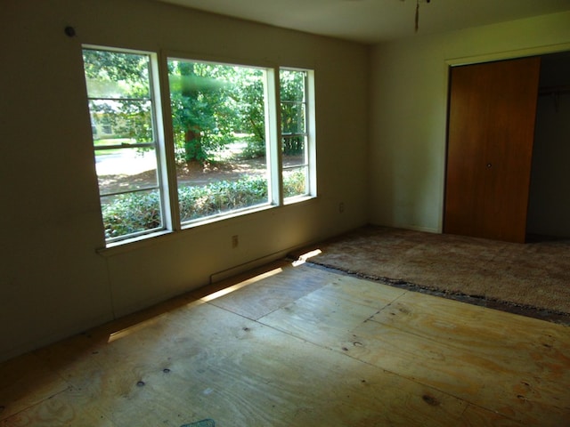 1202 Mimosa, Lufkin, TX 75901 - unfurnished bedroom with multiple windows and a closet