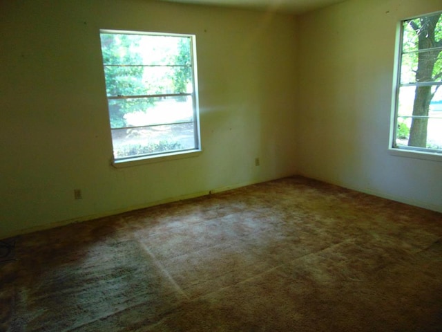 1202 Mimosa, Lufkin, TX 75901 - carpeted empty room with plenty of natural light