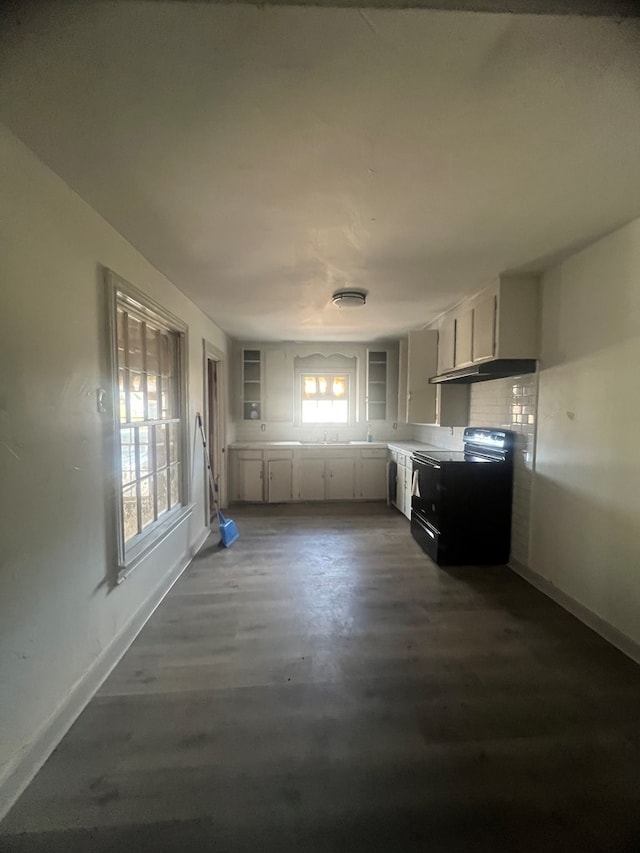 kitchen with white cabinets and black range with electric cooktop