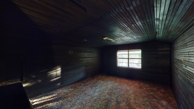 unfurnished room featuring vaulted ceiling