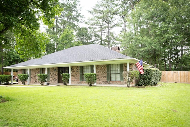 157 Craig St, Jasper, TX 75951 - view of front of home with brick siding, a porch, a chimney, and roof with shingles