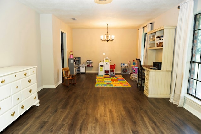 157 Craig St, Jasper, TX 75951 - dining space featuring dark wood finished floors, a chandelier, and a desk