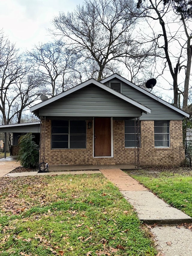 view of front facade with a carport