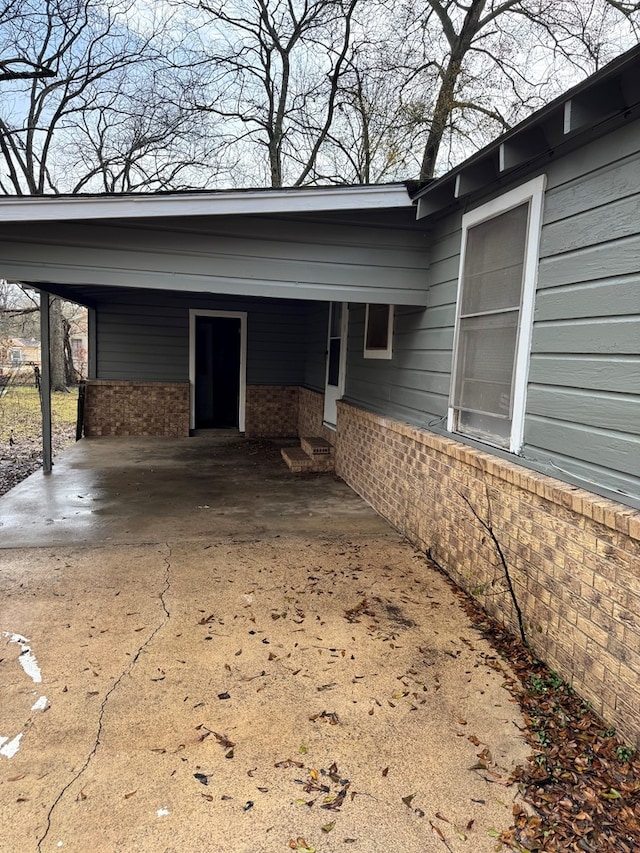 view of home's exterior featuring a carport