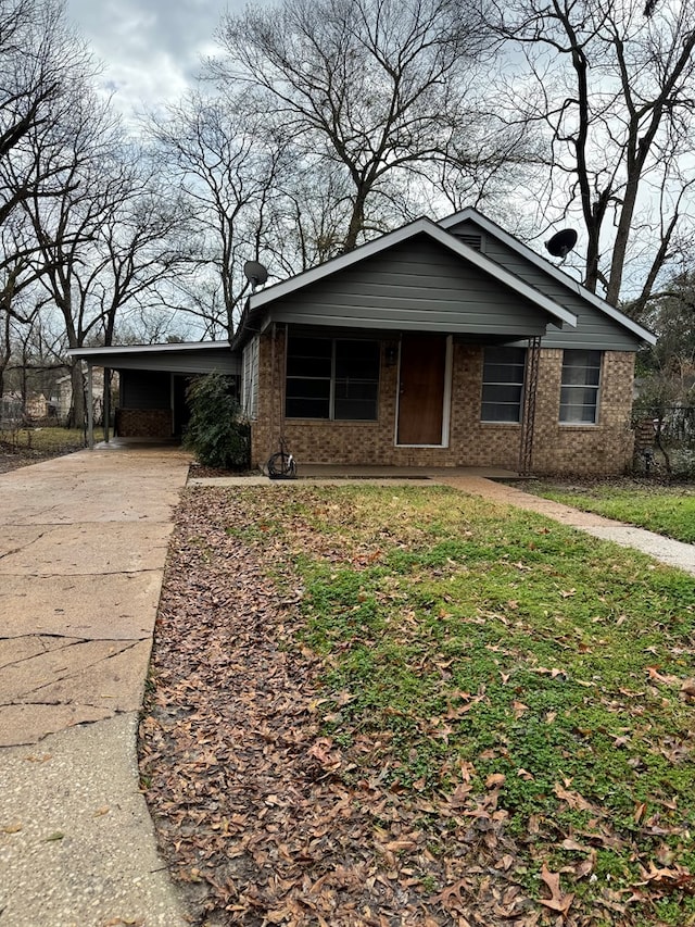 view of front facade with a carport