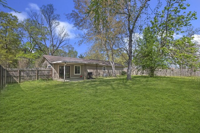 view of yard with a fenced backyard and a patio