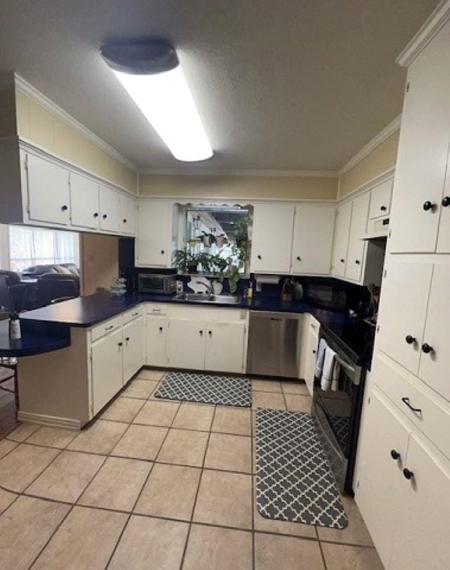 kitchen featuring white cabinetry, stainless steel dishwasher, and black range with electric cooktop