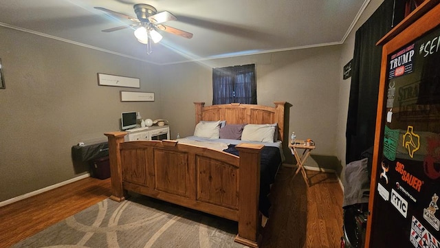 bedroom featuring ceiling fan, wood-type flooring, and crown molding