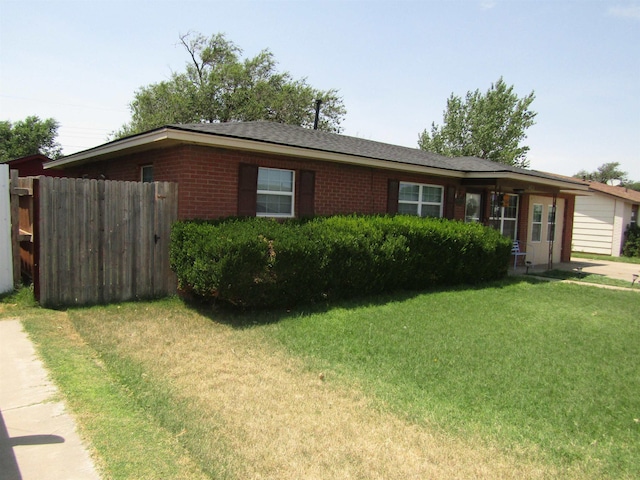 ranch-style home with a front yard