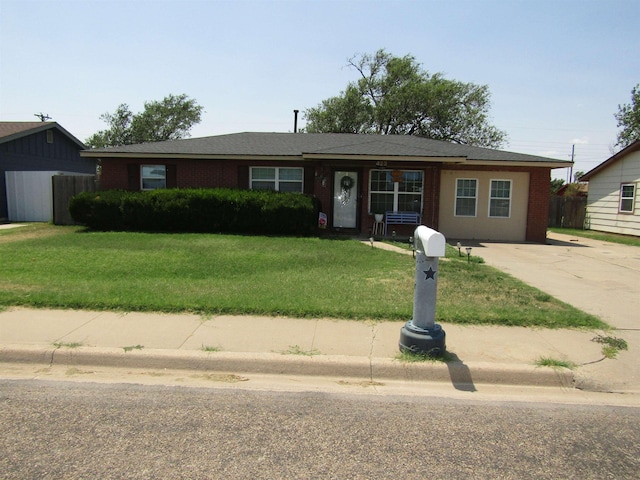 ranch-style house with a front yard