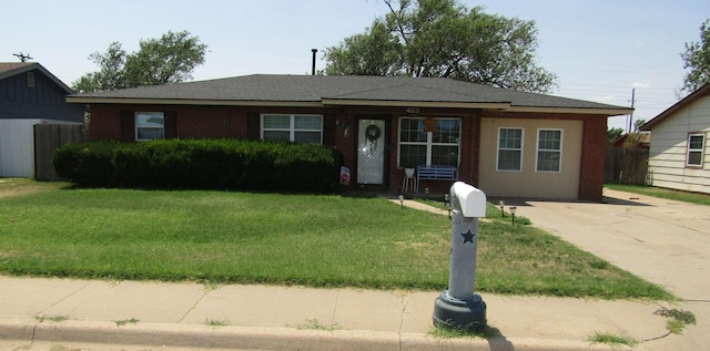 ranch-style home with a front lawn