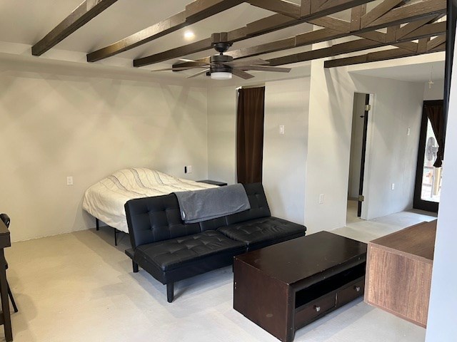 bedroom with beam ceiling