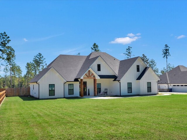 387 Cc Rd, Diboll, TX 75941 - modern inspired farmhouse with board and batten siding, a shingled roof, and a patio