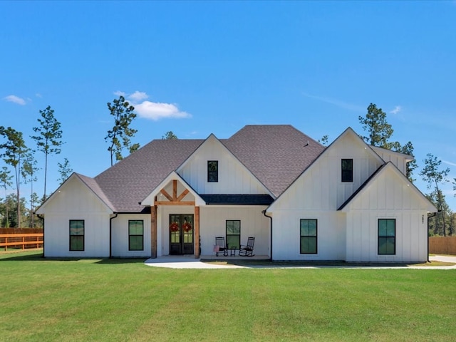 387 Cc Rd, Diboll, TX 75941 - modern farmhouse style home with board and batten siding, roof with shingles, a patio, and french doors