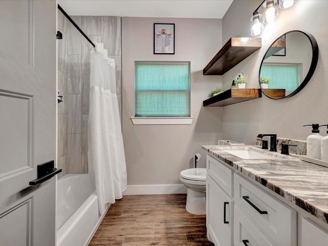 387 Cc Rd, Diboll, TX 75941 - bathroom with vanity, toilet, baseboards, wood finished floors, and shower / tub combo