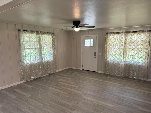 entrance foyer with hardwood / wood-style flooring and ceiling fan