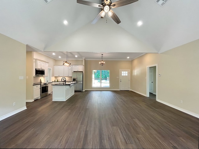 unfurnished living room with baseboards, dark wood-style floors, ceiling fan with notable chandelier, and high vaulted ceiling