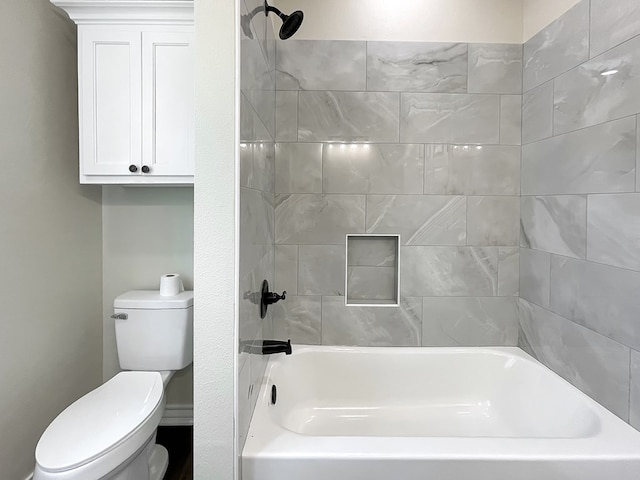 bathroom with shower / bath combination and toilet